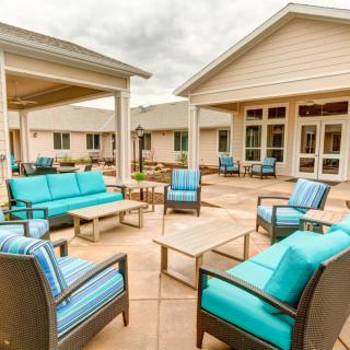 A modern outdoor patio with stylish seating arrangements.