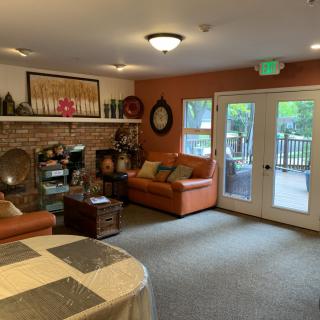 Cozy living room with comfortable seating and a fireplace.