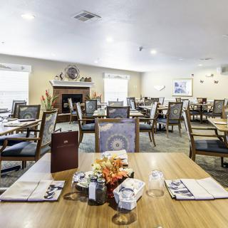 An inviting dining room setup with neatly arranged tables and chairs.