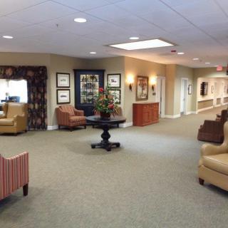 A spacious and well-decorated lobby area with comfortable seating and warm lighting.