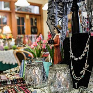 A charming display of jewelry and decorative items in a cozy shop setting.
