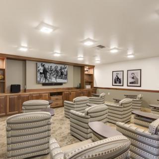 A cozy home theater with comfortable seating and ambient lighting.
