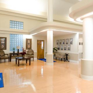 A bright and spacious lobby area featuring modern furniture and a welcoming atmosphere.