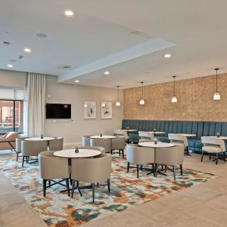 A modern dining area with stylish seating and contemporary lighting.
