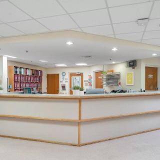 A well-lit reception desk in an office lobby.