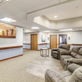 A modern waiting room with comfortable seating and elegant interior design.