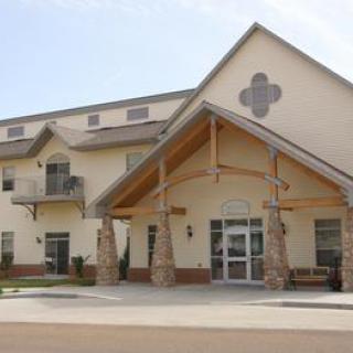 A residential building with a prominent entrance and traditional architectural design.