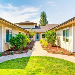 A beautiful suburban house with a well-maintained garden and pathway.