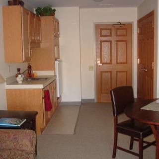 A compact kitchen and dining area in a small apartment.