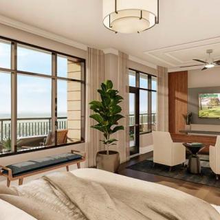 A modern and luxurious bedroom with natural light, featuring a balcony view and elegant interior design.