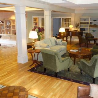 A cozy living room with comfortable seating and soft lighting.