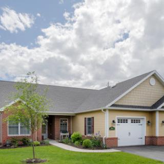 A charming single-story home with a well-maintained front yard and garage.