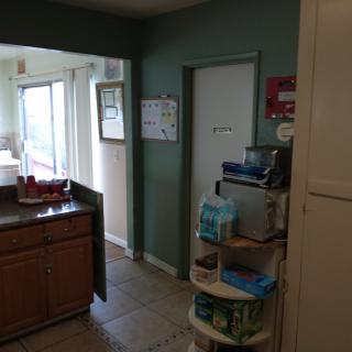 A kitchen with cabinets, countertops, and various appliances.