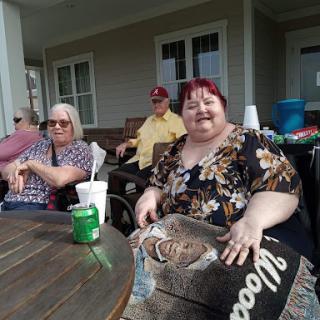 A cheerful gathering of friends enjoying a sunny day outdoors.