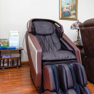 A modern massage chair in a cozy living room setting.