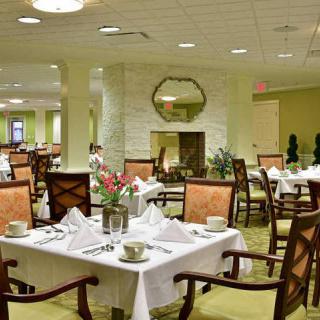 An elegant restaurant dining area with neatly arranged tables and comfortable seating.