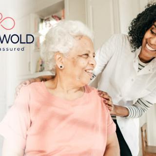 A caregiver shares a joyful moment with an elderly woman, highlighting the importance of support and companionship in home care.
