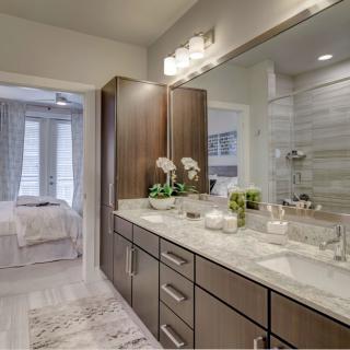 A modern bathroom with a double-sink vanity and sleek design elements.