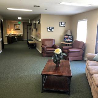 A cozy living room area with comfortable seating and tasteful decorations.