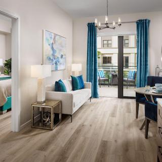 A modern living room with bright blue accents and elegant decor.