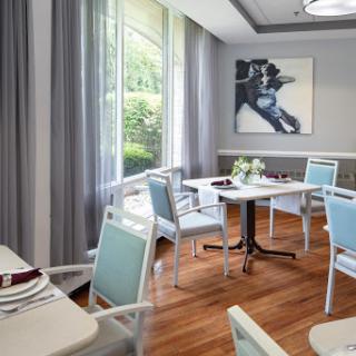 A stylish dining area with modern furniture and a touch of natural light.