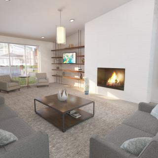 A modern living room with a cozy fireplace and contemporary furnishings.