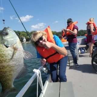 A fun day out on the water, celebrating a successful fishing trip with friends.
