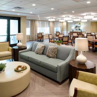 A modern and spacious living area with comfortable seating and elegant decor.