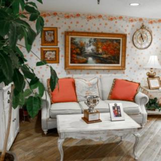 A cozy living room with elegant decor and a touch of nature.