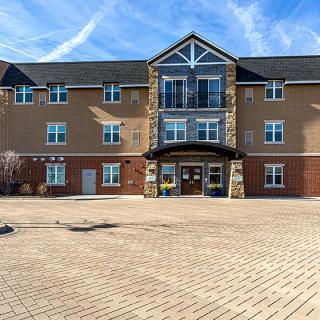A modern residential apartment building on a sunny day.