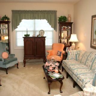 A traditional living room with classic furniture and decorations.