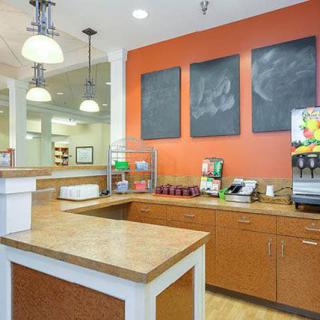 A modern kitchen counter setup in a restaurant or cafe interior.
