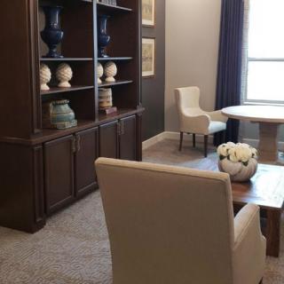 A cozy living room with elegant furniture and decor.