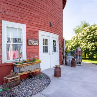 A charming red barn exterior, complete with rustic decorations and a welcoming entrance.