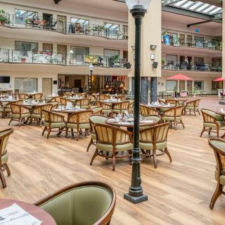 Spacious restaurant atrium with elegant seating arrangements.