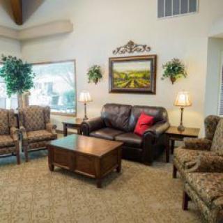A cozy living room with comfortable seating and elegant decor.