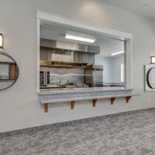 A modern kitchen showcasing an open design with ample cooking space and contemporary decor.