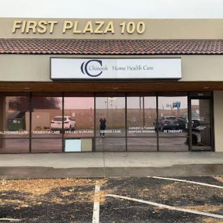 Exterior view of a commercial building named 'First Plaza 100' with signage for a health clinic.