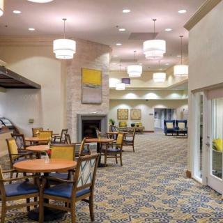 A modern hotel lobby with comfortable seating and stylish lighting.