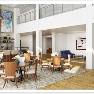 A modern open-space living and dining area with high ceilings and stylish furnishings.