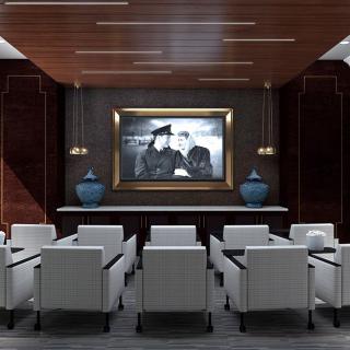 A modern lounge featuring white chairs, a large framed artwork, and elegant vases under a wooden ceiling.