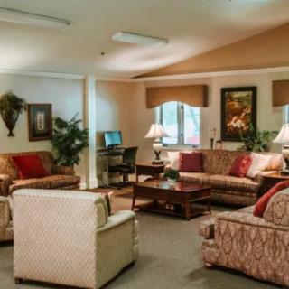 A cozy living room with elegant furniture and warm lighting.