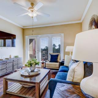 A cozy living room with modern furnishings and natural lighting.