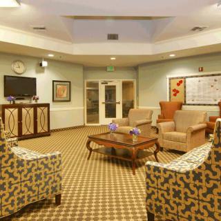 A cozy living room with comfortable seating and a television.