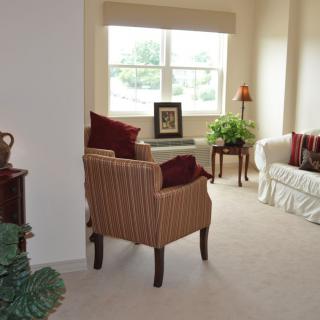 A cozy living room with comfortable seating and natural light.