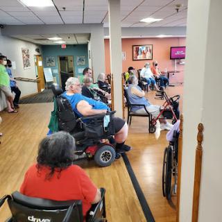 Residents enjoying a social gathering in a community center.