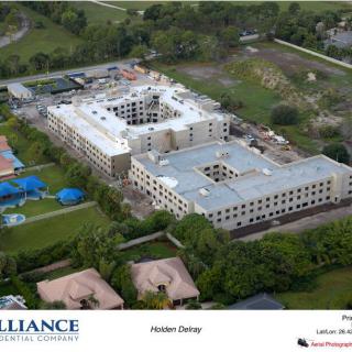 Aerial view of a construction site in a residential area.