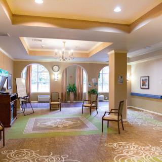 A spacious and well-lit lobby area with elegant decor and seating arrangements.
