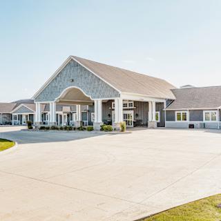 A modern hospitality building featuring a welcoming entrance and well-maintained exterior.