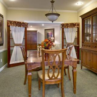 A beautifully arranged dining room with elegant furniture and decor.
